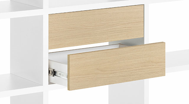 Two pull-out drawers with oak fronts built into a cube segment