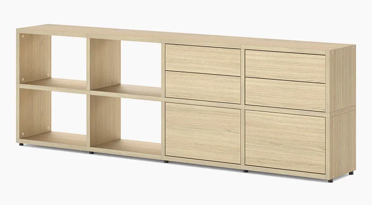 Sideboard in light-coloured wood with four open compartments on the left, two drawer inserts and two doors on the right